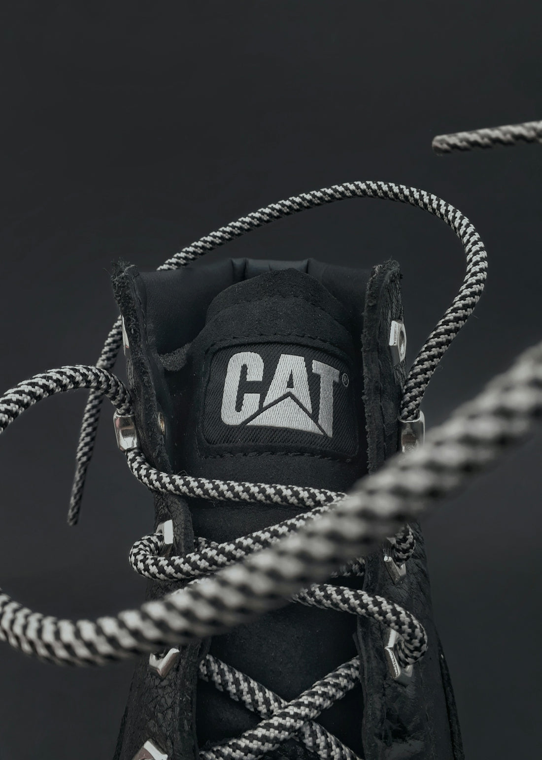 a close up of a shoe with a rope
