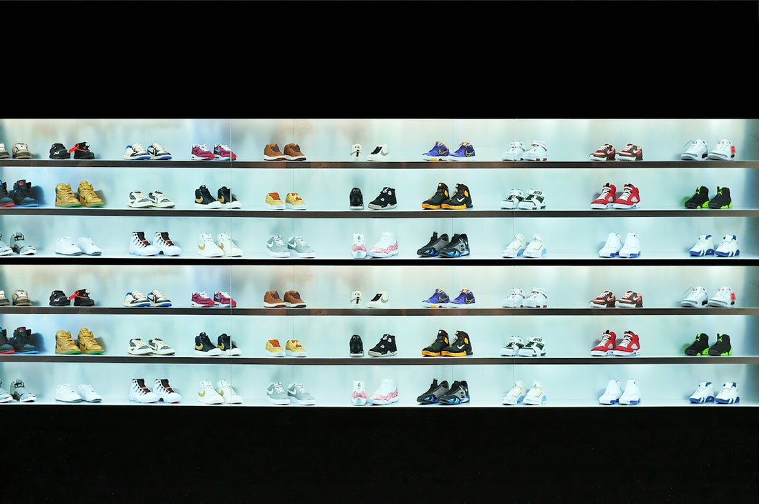a display case filled with lots of different types of shoes