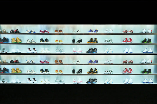 a display case filled with lots of different types of shoes