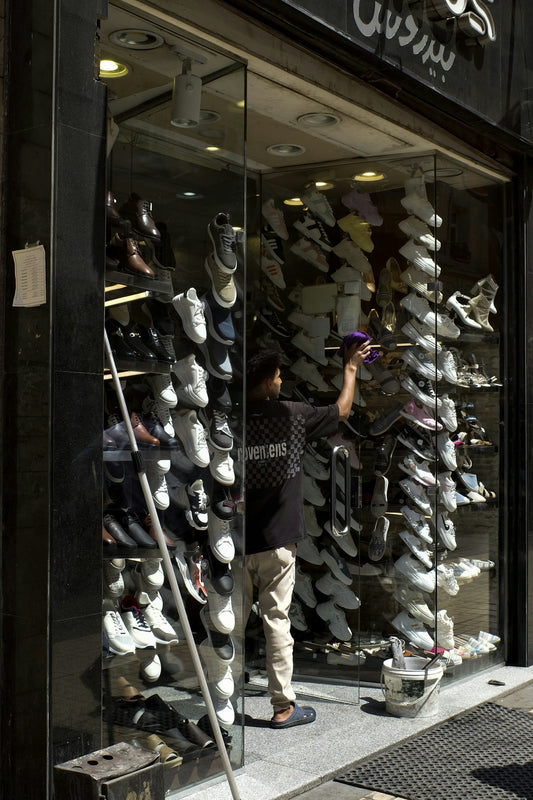 A man standing in front of a shoe store