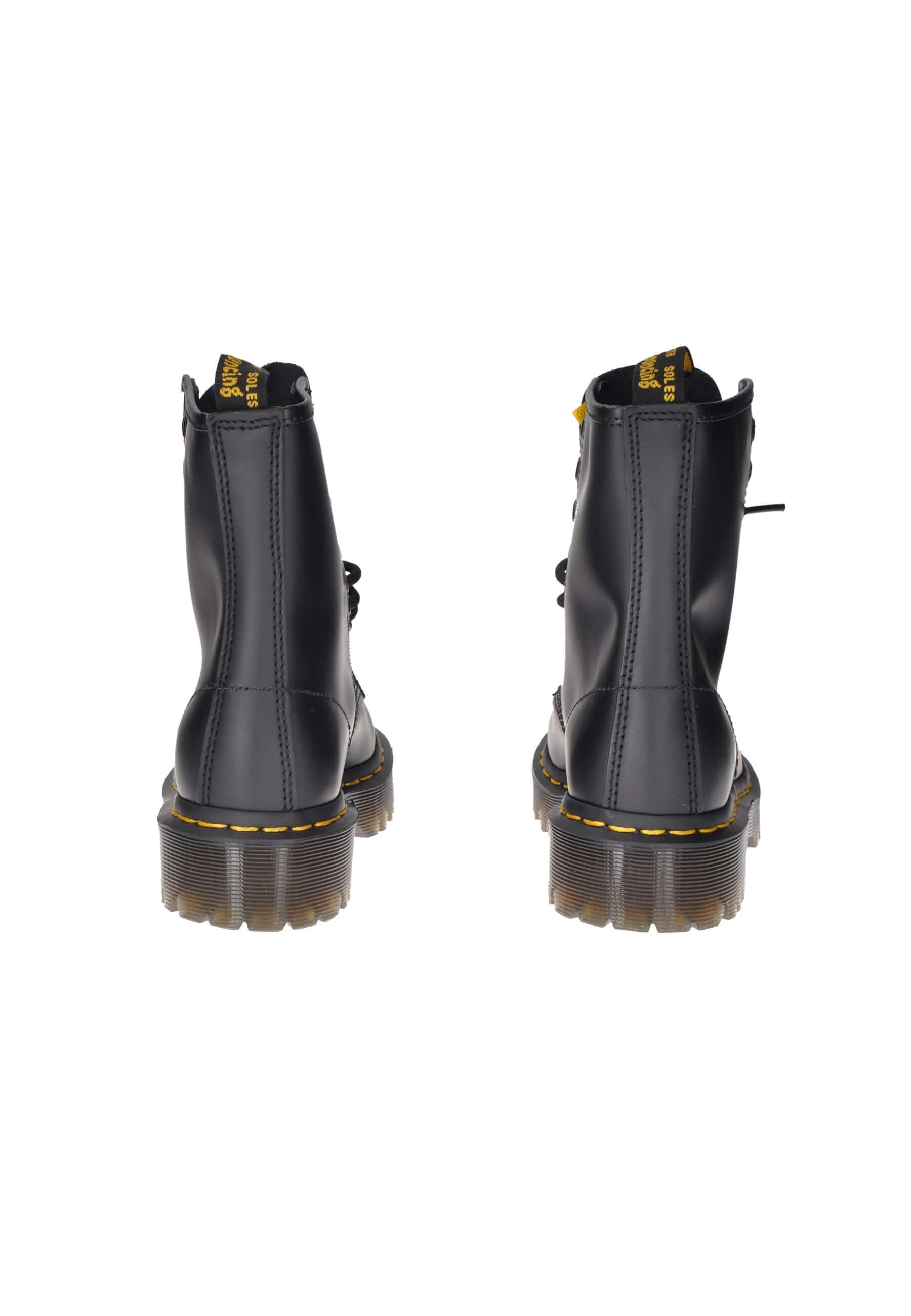 Rear view of Dr. Martens 1460 Bex boots in black leather with lace closure and chunky rubber sole.