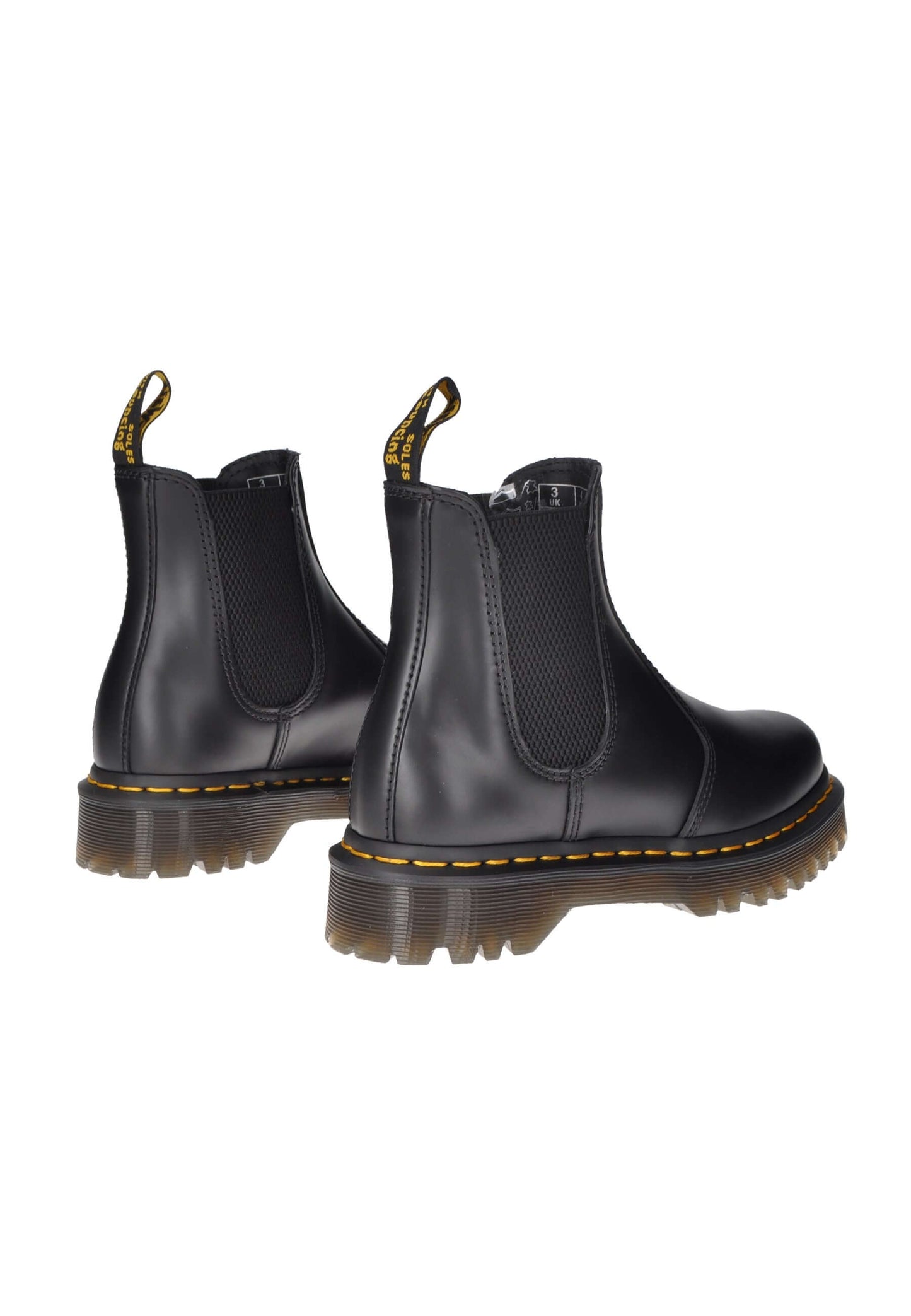 Black Dr. Martens 2976 Bex boots with elastic closure and chunky rubber sole, showcasing a stylish and comfortable design.