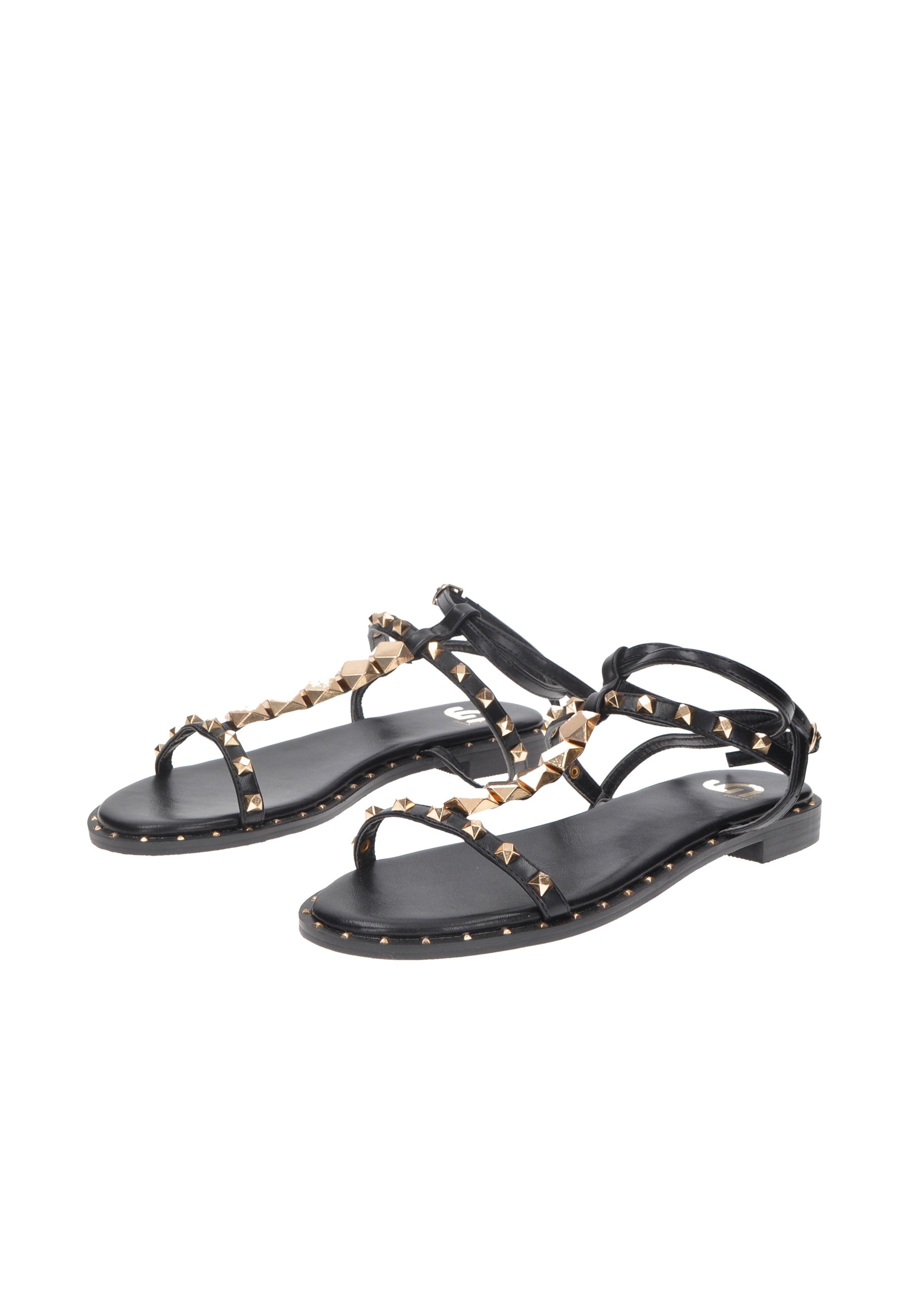 Black studded sandals with flat sole and stylish straps for a chic summer look.