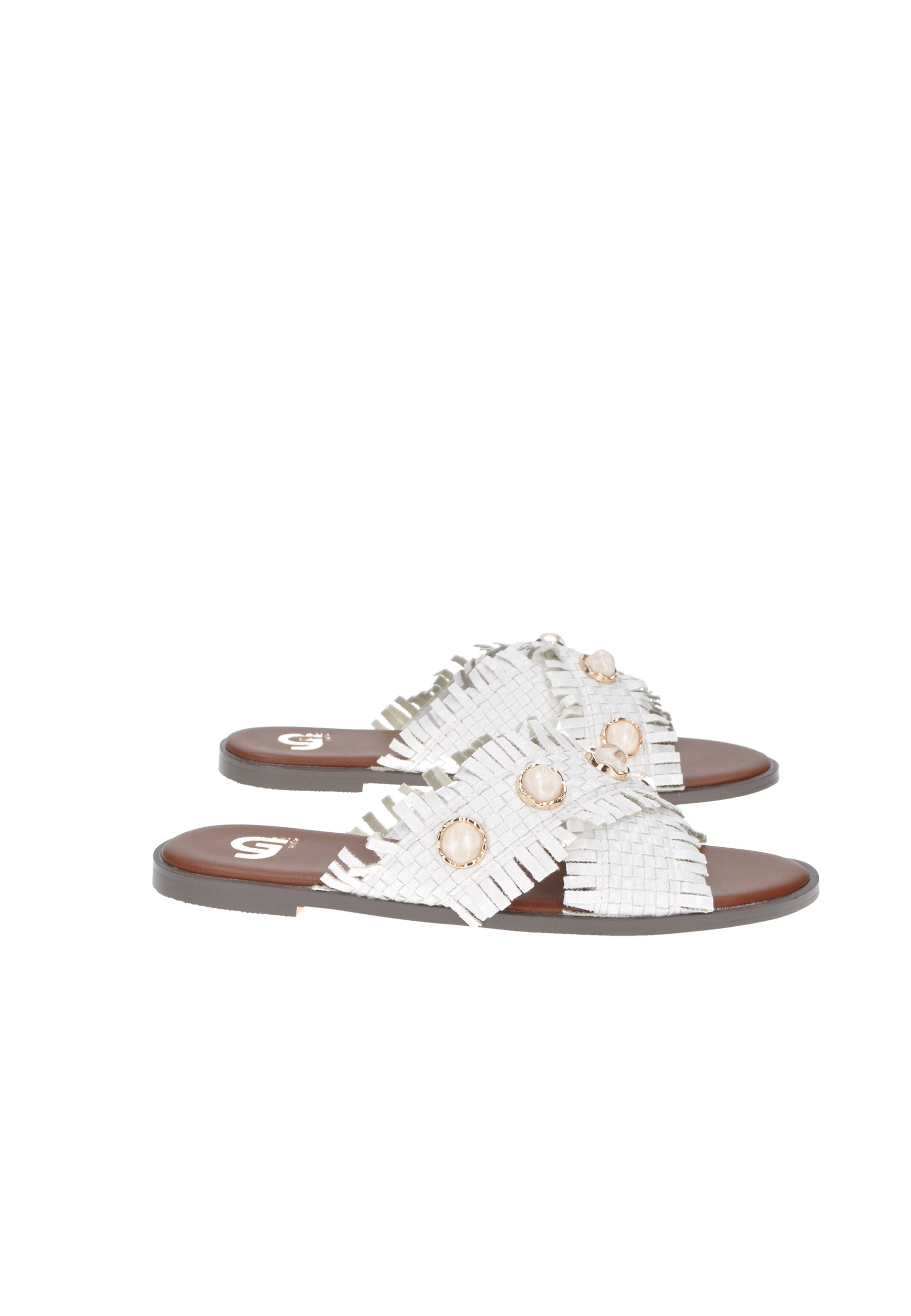 Stylish white sandals with fringe and decorative gems on a brown sole for summer elegance.